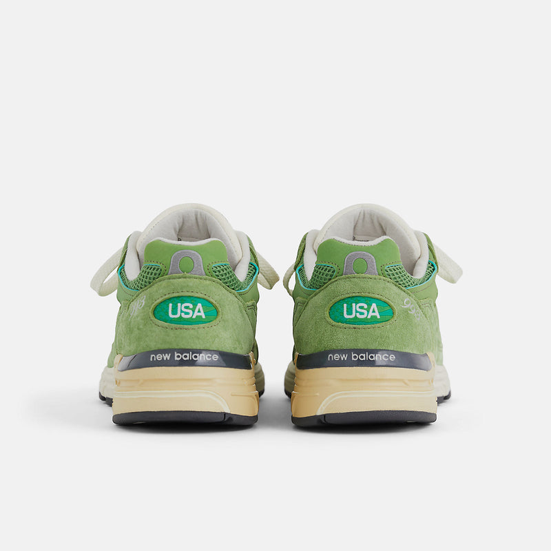 New Balance 993 from the MADE in USA Seasonal Collection, featuring a mesh upper overlaid with premium nubuck in 'chive' green, atop a dual-color white and off-white midsole.