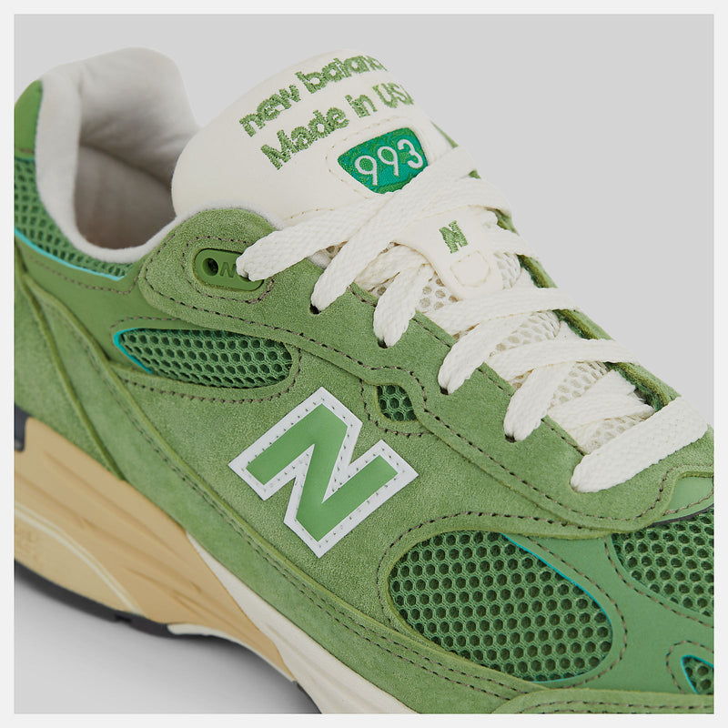 New Balance 993 from the MADE in USA Seasonal Collection, featuring a mesh upper overlaid with premium nubuck in 'chive' green, atop a dual-color white and off-white midsole.