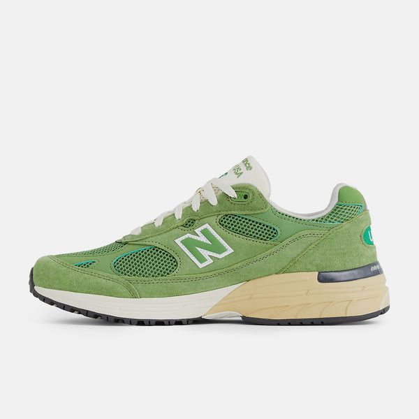 New Balance 993 from the MADE in USA Seasonal Collection, featuring a mesh upper overlaid with premium nubuck in 'chive' green, atop a dual-color white and off-white midsole.