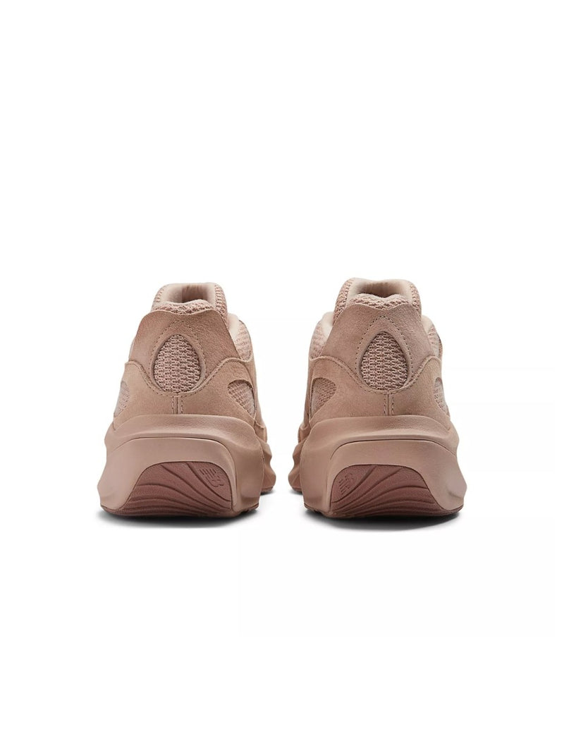 Warped Runner sneaker from the Shifted series, showcasing its sculptural and futuristic design in warm seasonal colors