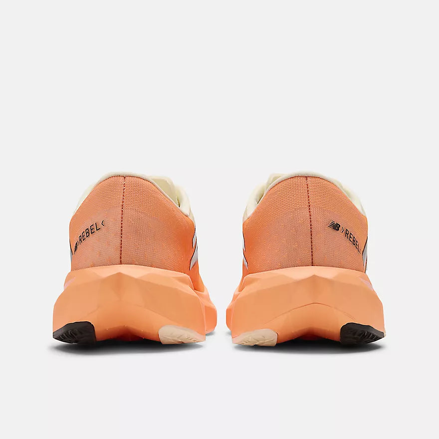 New Balance FuelCell Rebel v4 running shoe with a lightweight mesh upper, responsive FuelCell cushioning, and a sleek, race-inspired design.