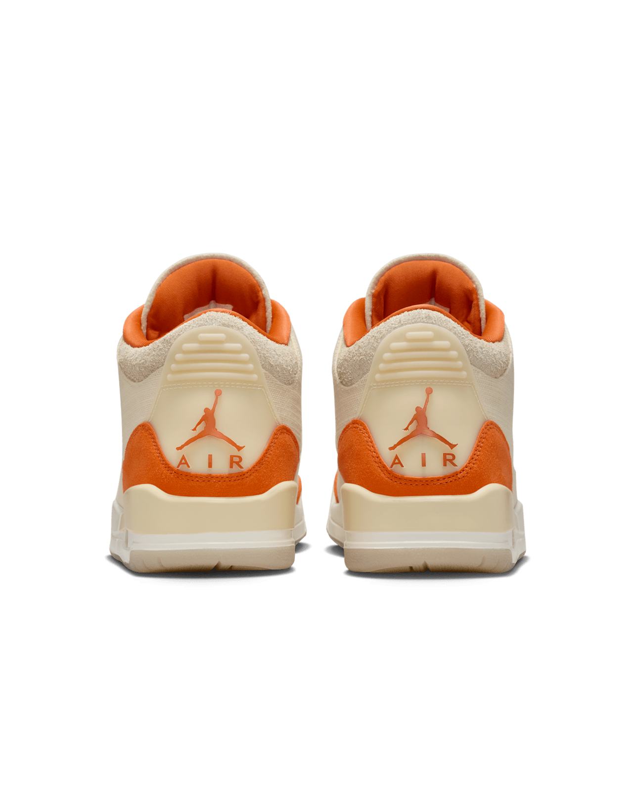 Women’s Air Jordan 3 sneakers in neutral canvas and suede with orange accents, inspired by MJ’s legendary backboard-shattering exhibition game in Italy.