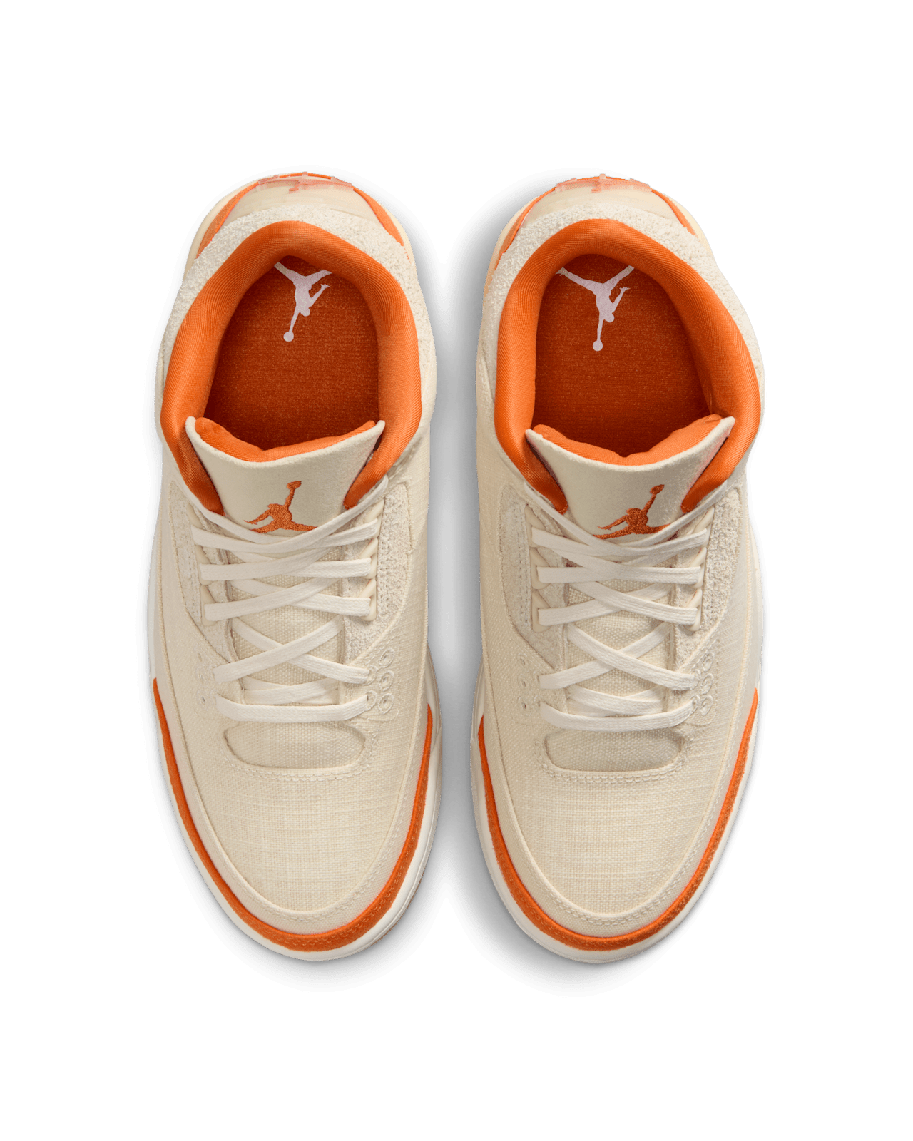 Women’s Air Jordan 3 sneakers in neutral canvas and suede with orange accents, inspired by MJ’s legendary backboard-shattering exhibition game in Italy.