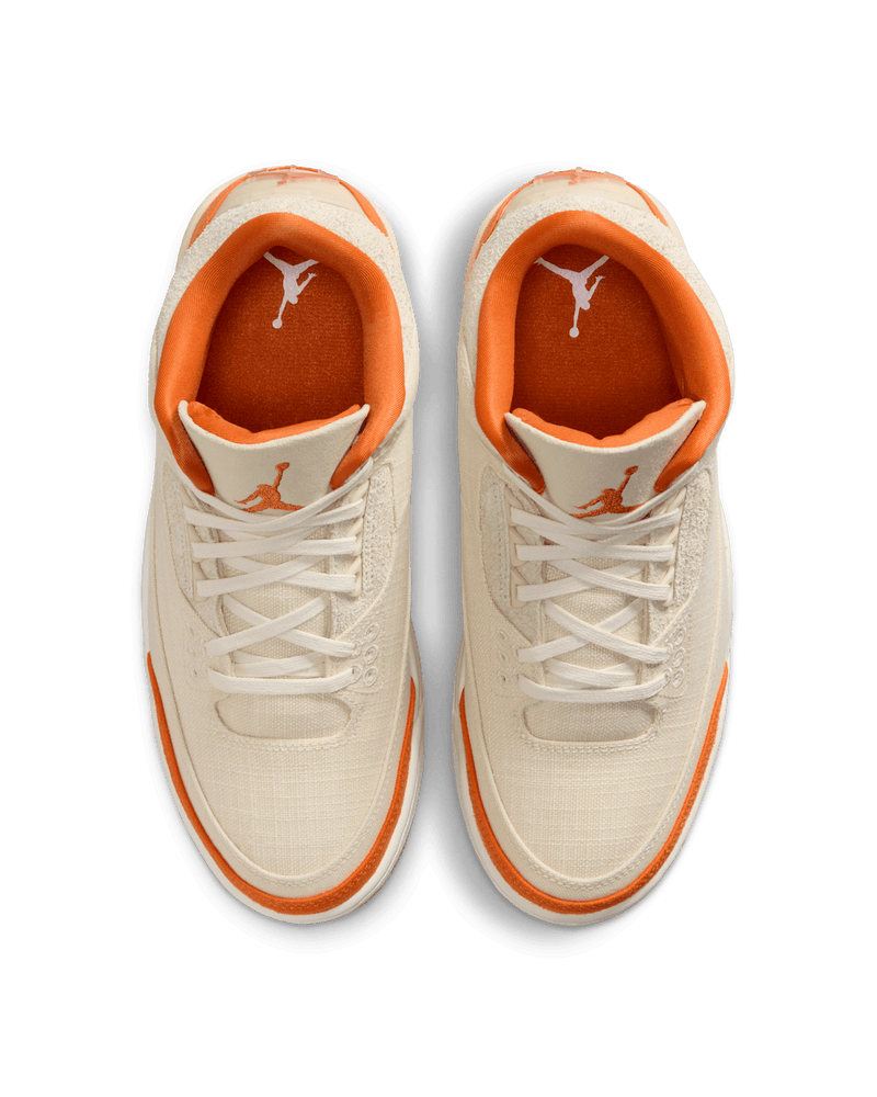 Women’s Air Jordan 3 sneakers in neutral canvas and suede with orange accents, inspired by MJ’s legendary backboard-shattering exhibition game in Italy.