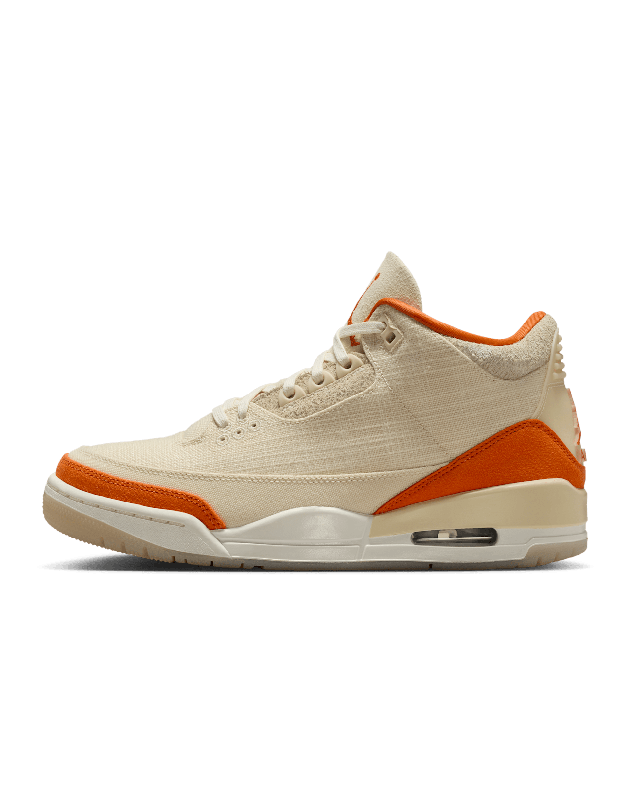 Women’s Air Jordan 3 sneakers in neutral canvas and suede with orange accents, inspired by MJ’s legendary backboard-shattering exhibition game in Italy.