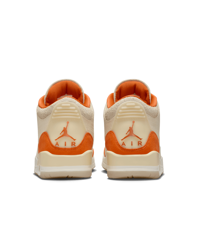 Women’s Air Jordan 3 sneakers in neutral canvas and suede with orange accents, inspired by MJ’s legendary backboard-shattering exhibition game in Italy.