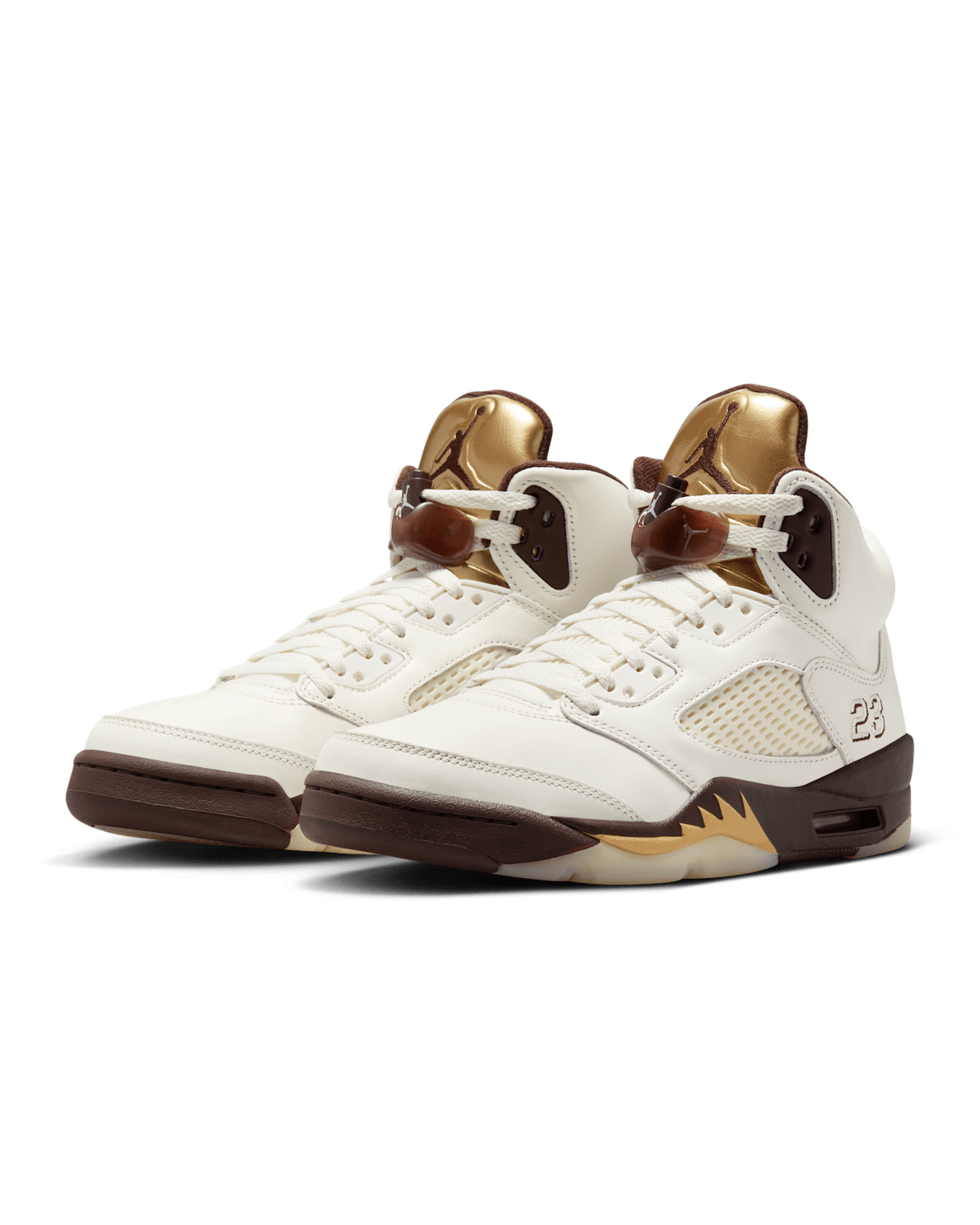 Air Jordan 5 ‘Golden Ticket’ sneaker with Sail leather, Earth-toned midsole, Metallic Gold tongue, and signature lace locks.