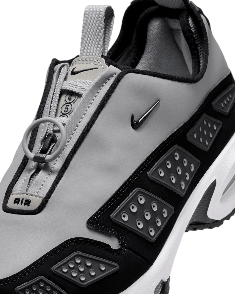 Air Max SNDR sneaker with zip-up shroud, featuring black, silver, and anthracite colorway and Max Air cushioning.