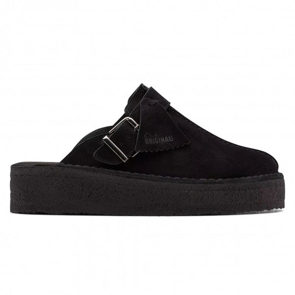 Clarks Originals Trek wedge heel mules in black suede, showcasing a slip-on design with an adjustable pin-buckle strap, center split seam, and rounded toeline