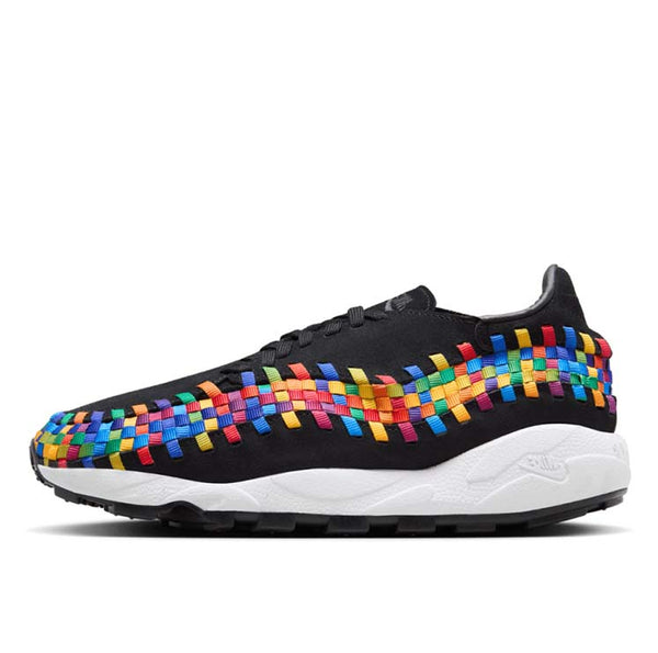 Comfy classic Footscape in vibrant colorway, showcasing wide toe box and asymmetrical woven details on black suede upper.