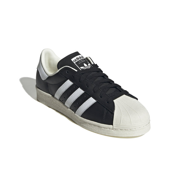 adidas Superstar 82 shoes featuring smooth leather, signature rubber shell toe, and rubber cupsole.