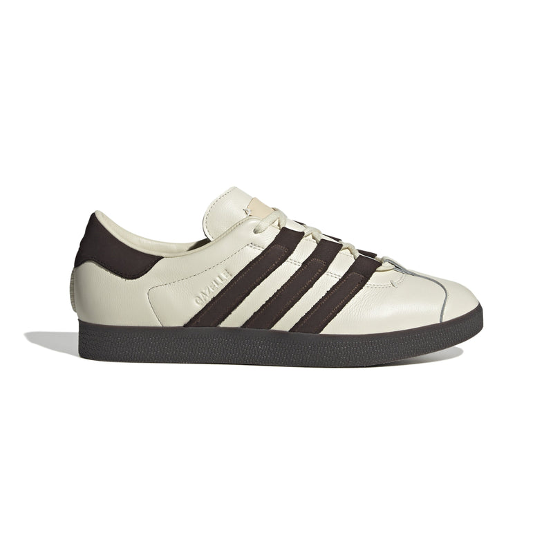 adidas Gazelle shoes in collaboration with Foot Industry, featuring a premium leather upper, molded sockliners for comfort, decorative leather tongue label, co-creation logo on the heel, and durable rubber outsole.