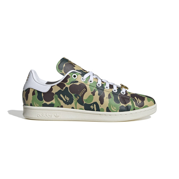 Adidas Stan Smith shoes in collaboration with BAPE, featuring a flexible upper with a bold stylized camo print for a striking look. 