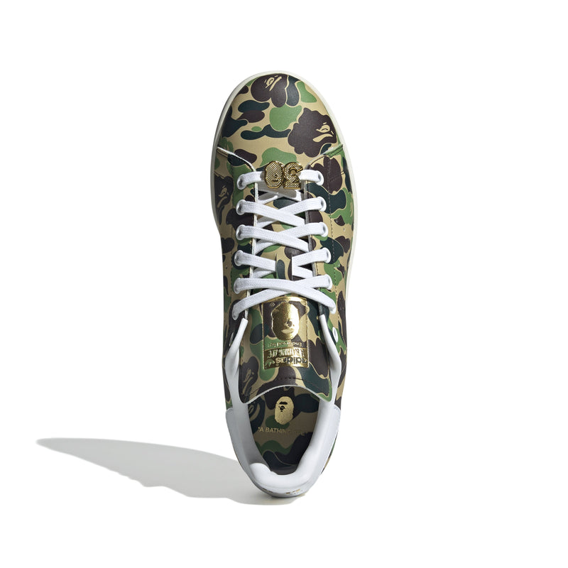 Adidas Stan Smith shoes in collaboration with BAPE, featuring a flexible upper with a bold stylized camo print for a striking look. 