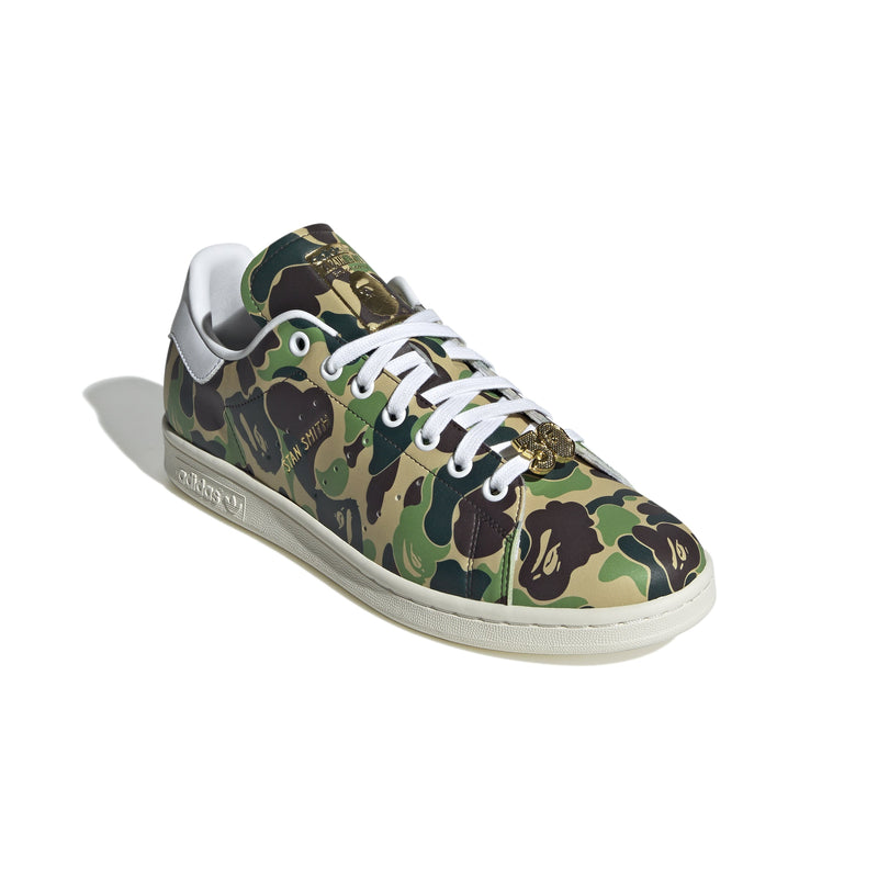 Adidas Stan Smith shoes in collaboration with BAPE, featuring a flexible upper with a bold stylized camo print for a striking look. 