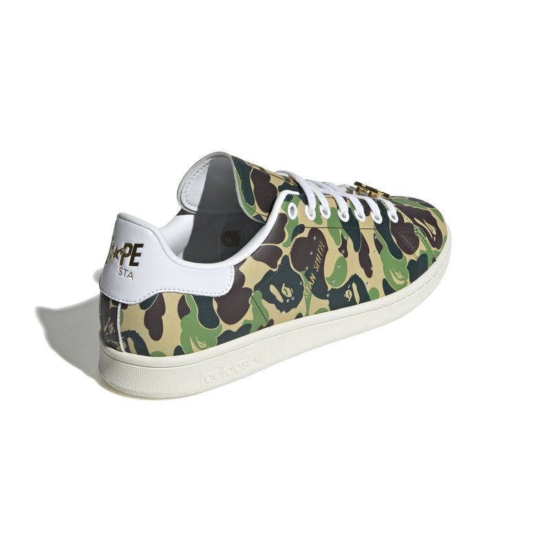 Adidas Stan Smith shoes in collaboration with BAPE, featuring a flexible upper with a bold stylized camo print for a striking look. 