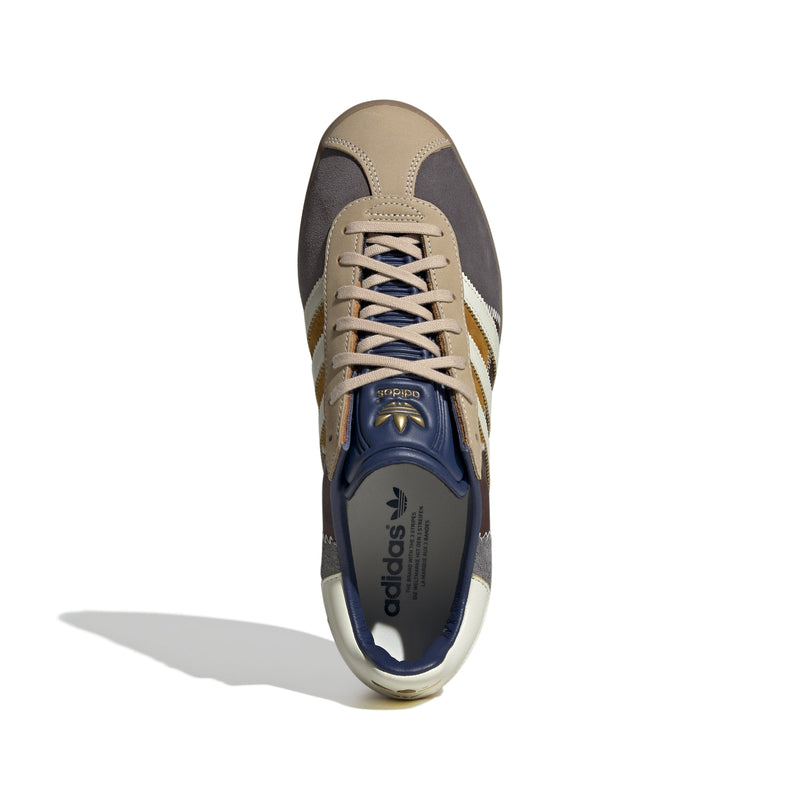 adidas Gazelle 85 shoes showcasing the smooth leather and soft suede accents in a classic, retro-inspired design.